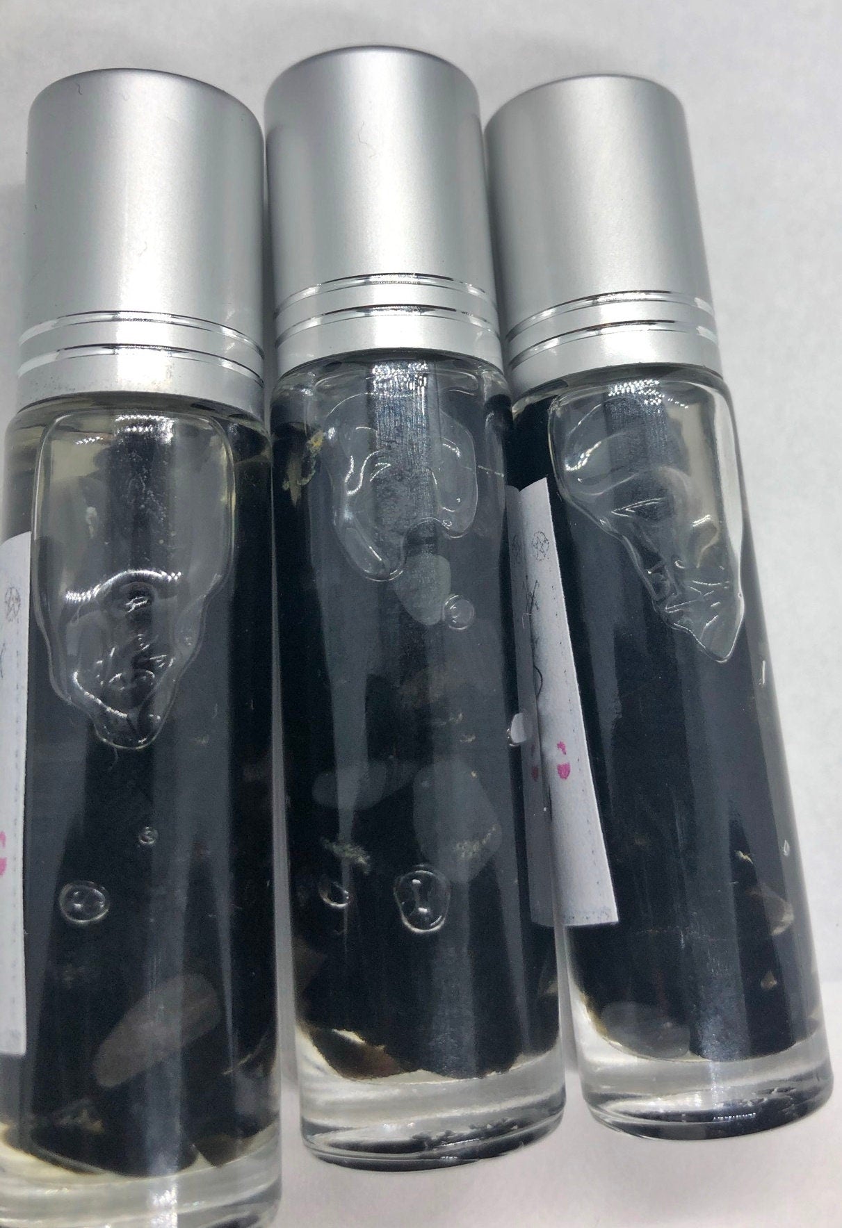 full moon anointing oil with charged obsidian